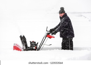 Man Using A Snowblower