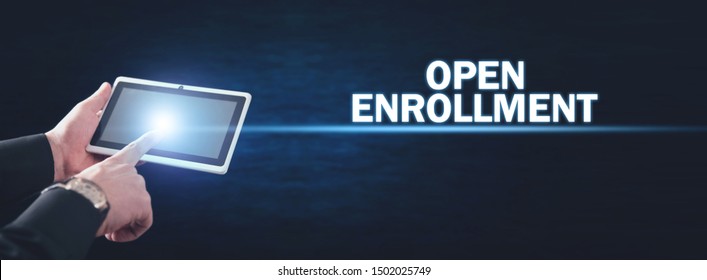 Man using tablet computer. Open Enrollment