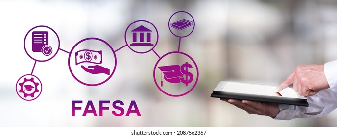 Man Using A Tablet With Fafsa Concept