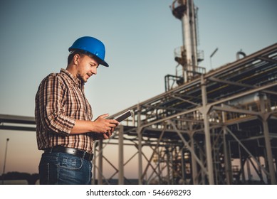 Man Using Tablet At Natural Gas Factory