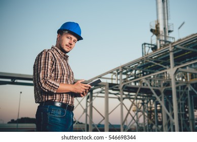 Man Using Tablet At Natural Gas Factory