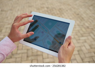 Man using a tablet with navigation application