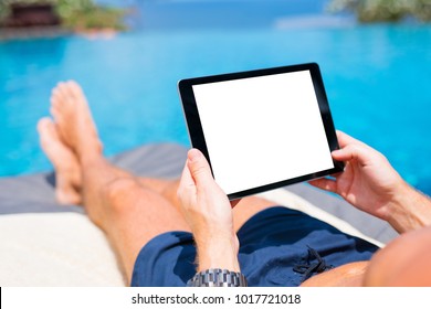 Man Using Tablet On Vacation By The Pool. Digital Tablet Mockup, Horizontal Screen Orientation.