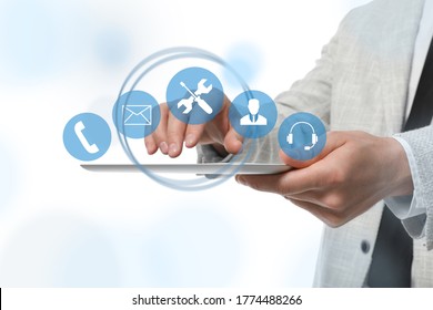 Man Using Tablet On White Background, Closeup. Technical Support 