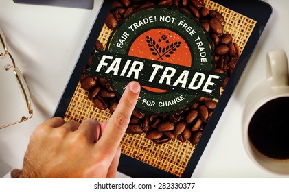Man using tablet pc against fair trade