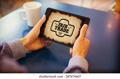 Man using tablet pc against fair trade