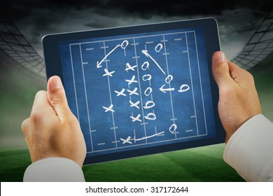 Man using tablet pc against rugby tactics