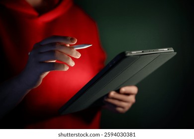 Man is using tablet pc. Computer and hands close up.