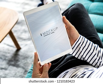 Man Using A Tablet With A Screen Mockup