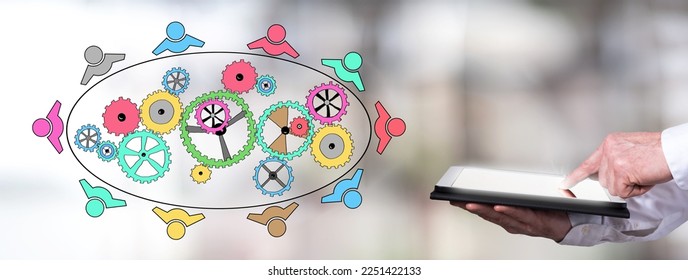 Man using a tablet with teamwork concept