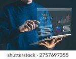 Man using tablet with virtual screen displaying SEO analytics, data charts, and marketing performance metrics. Concept of search engine optimization, business growth, data analysis, and digital marketing strategy.
