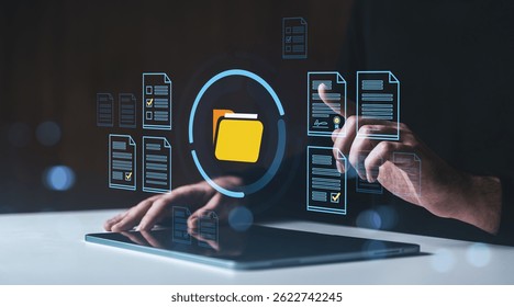Man using touchscreen tablet with digital folder and document icons, modern interface style, on dark background, concept of data organization