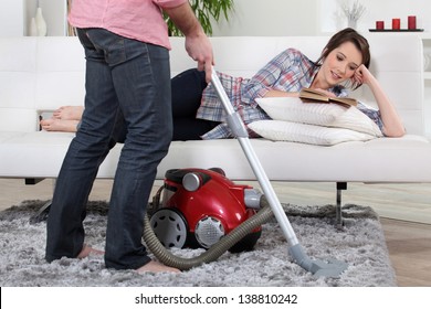 Man Using Vacuum Cleaner