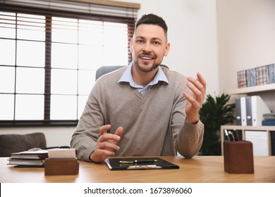 Man Using Video Chat In Office, View From Web Camera