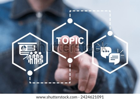 Man using virtual innovative touch interface presses word: TOPIC. Examine and study topic. Trending topic. Hot topics. Business Education Web Technology Communication Concept.