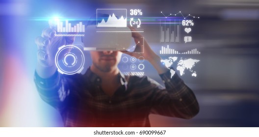 Man using virtual reality glasses while gesturing against blur view of office corridor and workspace