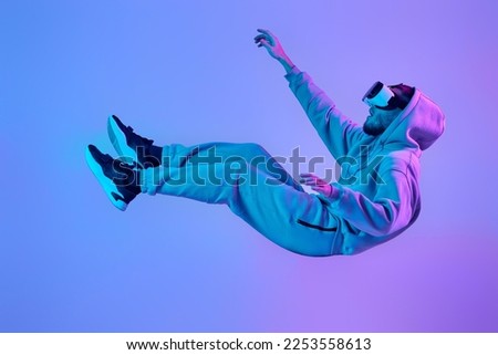 man using virtual reality glasses and playing video games