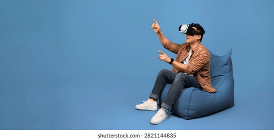 Man Using Virtual Reality Headset, Engaging In Immersive Experience, Focused At Home