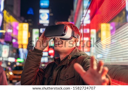 Man using virtual reality in Time Square, New York