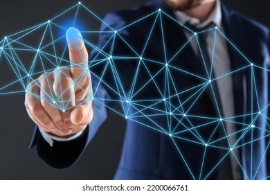 Man using virtual screen with connection lines presenting innovation network linkage on dark background