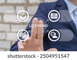 Man using virtual touch screen presses text: LICENSING. License agreement business technology concept. Copyright protection law license property rights.