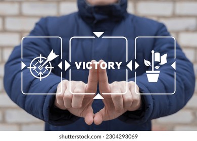Man using virtual touch screen presses inscription: VICTORY. Concept of business victory. Trophy, champions award, sport victory. Competition success, first place, best win, celebration.