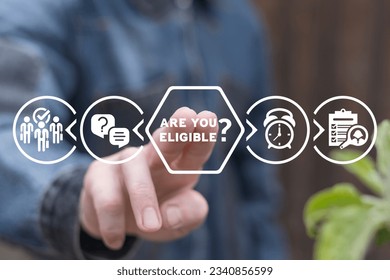 Man using virtual touch screen touches inscription: ARE YOU ELIGIBLE? Concept of business, social eligibility. Are you eligible?
