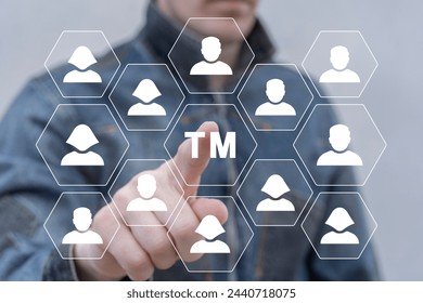 Man using virtual touch screen presses abbreviation: TM. Trademark ( TM ) copyright or patent business industry technology concept. Trade mark protection. Reistered and unregistered service trademark.