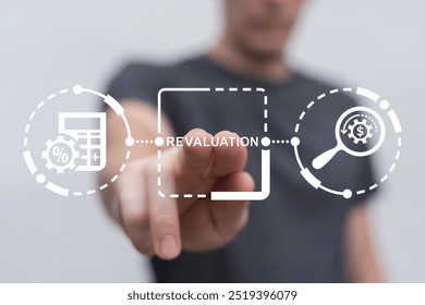 Man using virtual touch screen presses word: REVALUATION. Revaluation Business Finance concept. Revalue and calculate. Business failure and crisis.