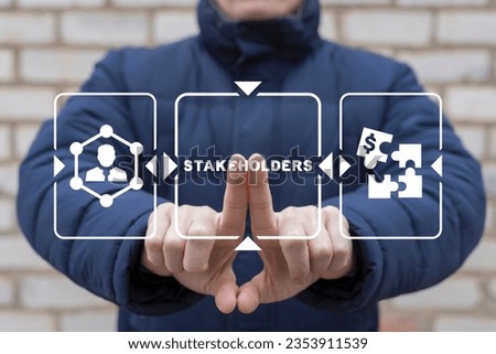 Man using virtual touch screen presses text: STAKEHOLDERS. Business and finance concept of stakeholder investing management. Different stakeholders contact collaboration for company organization.	