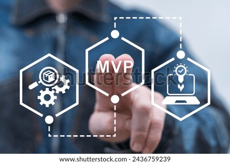 Man using virtual touch screen presses abbreviation: MVP. Minimum Viable Product ( MVP ) Business concept for lean startup. Life cycle of product development. Analysis and market validation.