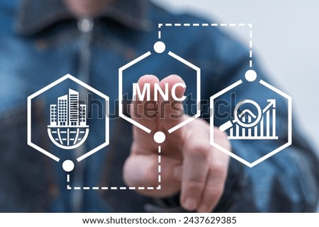 Man using virtual touch screen presses abbreviation: MNC. Multinational Corporation (MNC) business strategy concept. Standardizing products and services around the world to gain efficiency.