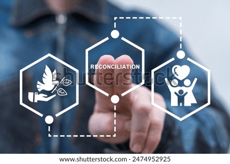 Man using virtual touch screen presses word: RECONCILIATION. Concept of business truth and reconciliation. Reconciliation can be difficult and needs cooperating pieces that fit together.