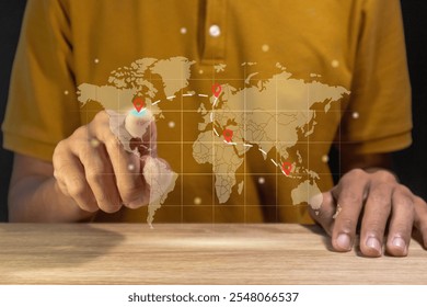 Man using a virtual world map to plan a trip between countries