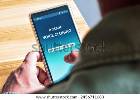 Man using Voice Cloning mobile applications to create AI voice. The danger and benefits of artificial intelligence use concepts.