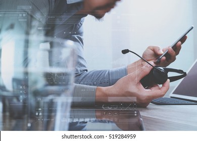 Man using VOIP headset with digital tablet computer docking smart keyboard, concept communication, it support, call center,screen graphic virtual icons,graph,diagram