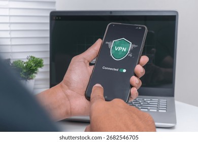 Man using a VPN on smartphone. Internet security and virtual private network concept.