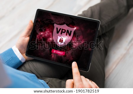 Man using VPN (Virtual Private Network) on tablet