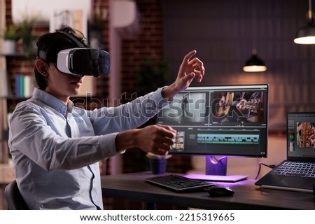 Man using vr glasses to edit film footage with computer software app. Videographer editing movie montage with visual and sound effects, creating video for multimedia production.