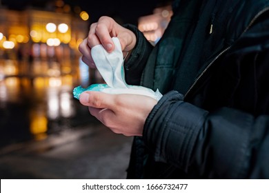 Man Using Wet Wipes To Clean His Hands, Hygiene Concept , Virus Protection  