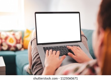 Man Using, Working On Laptop With Blank Screen While Lying On Sofa In Living Room. Mockup Template