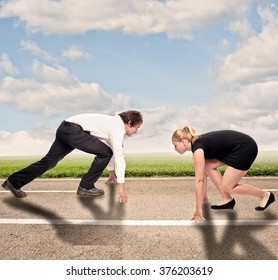 Man Versus Woman On A Road Ready To Run