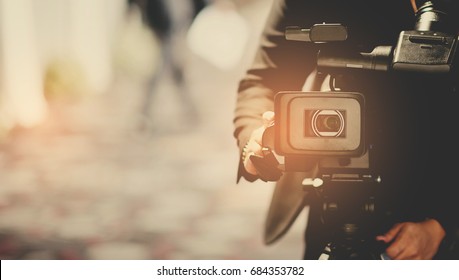 man with video camera - Shutterstock ID 684353782
