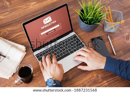 Man viewing newsletter signup page on his laptop screen