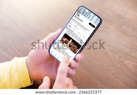 Man viewing someone's profile page on sample social media app