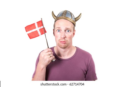 Man With Viking Helmet And Danish Flag Looking Sad. Scandinavian Middle Age Male Isolated On White