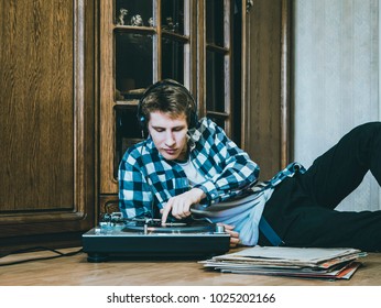 Man With Vinyl Records In Hands Listens To The Music 