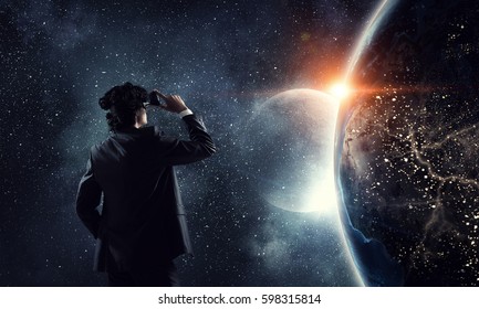 Man in virtual helmet . Mixed media - Powered by Shutterstock