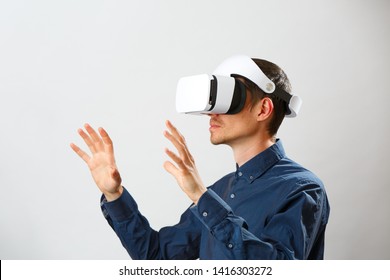Man with virtual reality headset is playing game.