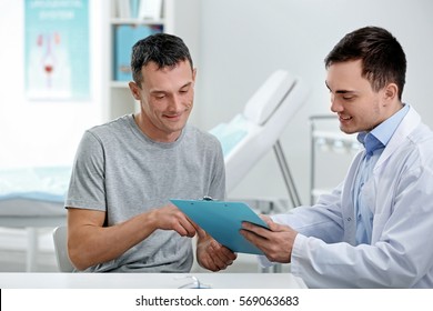 Man Visiting Doctor At Hospital